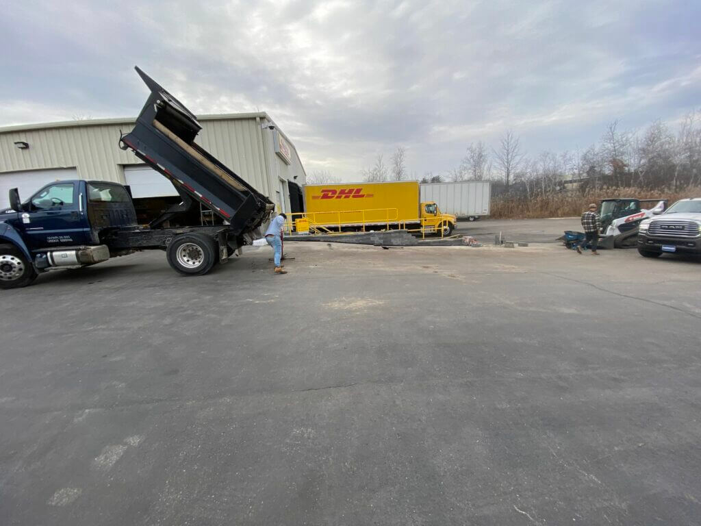 Asphalt paving company unloading materials